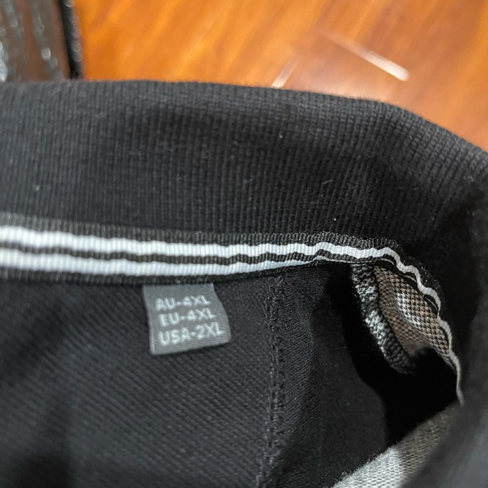 Stylish Black Polo Shirt with White Accents - Picture 6 of 10